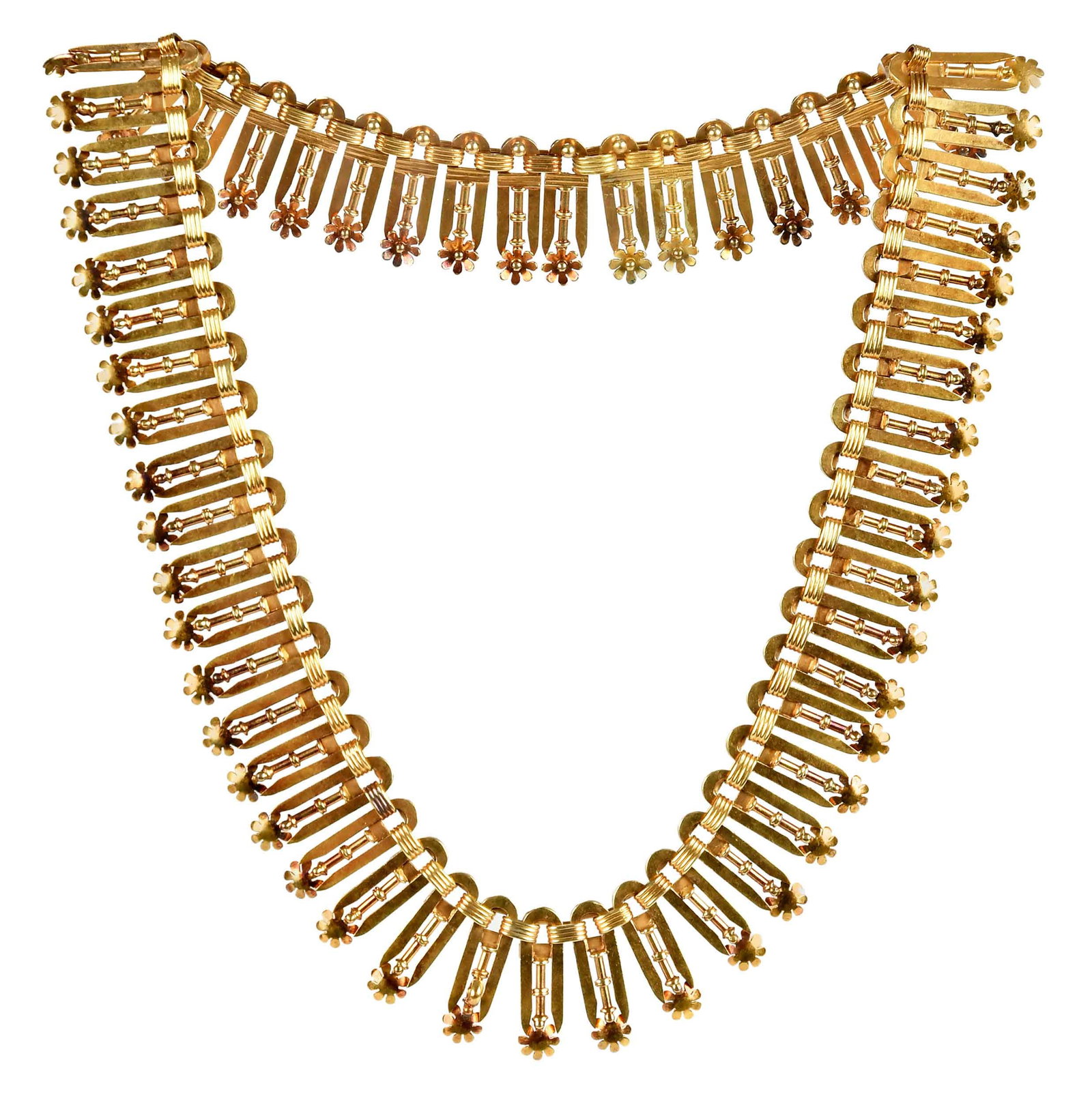 14kt. Etruscan Revival Fringe Collar Necklace: flexible flat collar design, vertical terminals completed with flower drops, tests 14kt. yellow gold, 15-1/2 in. length, 21.0mm wide, 66.9 g, in box marked "Harvey & Gore London" Provenance: Private V