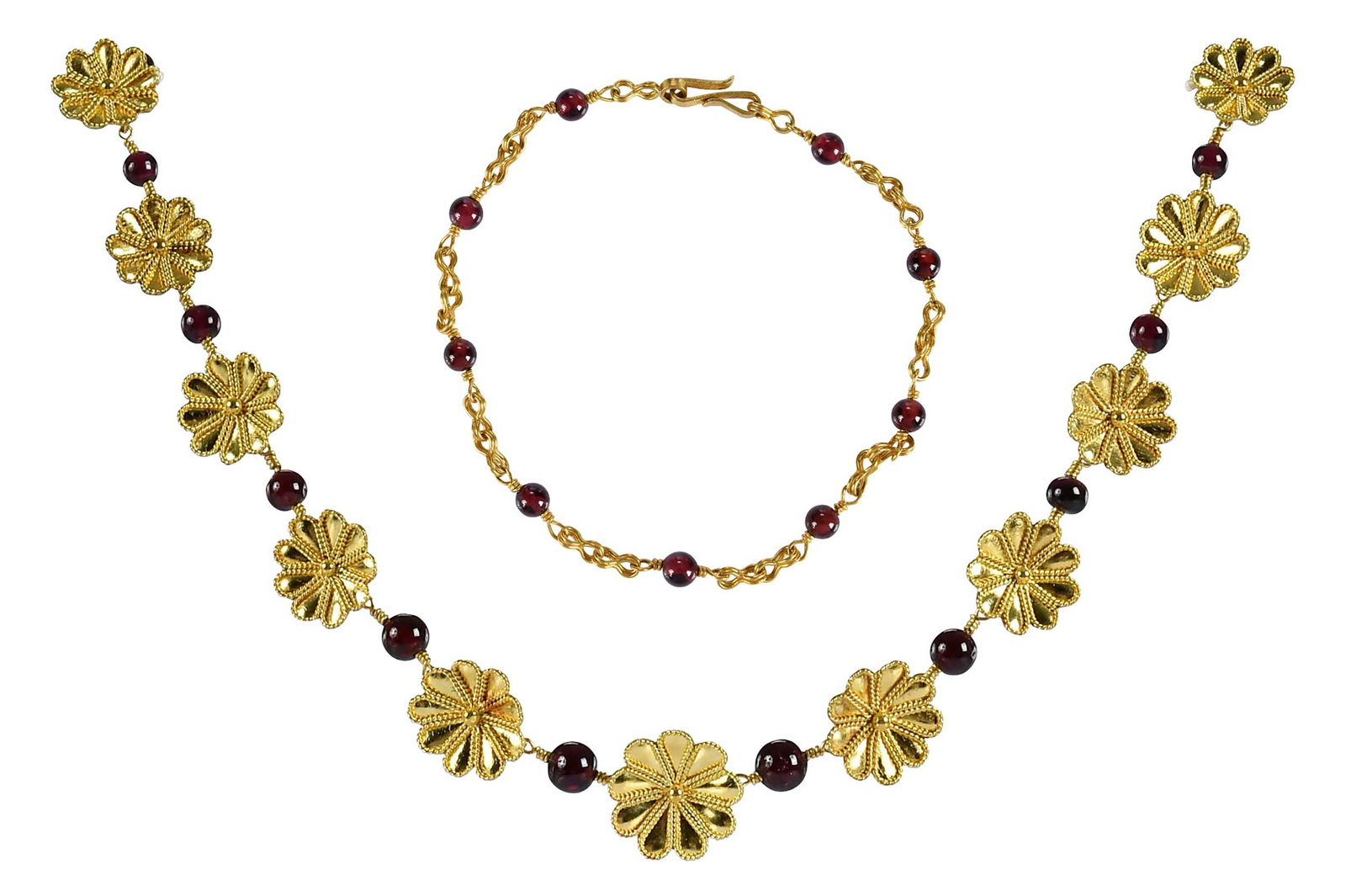 18kt. Etruscan Revival Style Flower and Garnet Bead Necklace, and Bracelet: alternating flower charms, approx. 15.0mm diameter, garnet beads, approx. 6.0mm, tests 18kt. yellow gold, 17 in. length; garnet beads, approx. 4.0mm, tests 18kt. yellow gold, 7 in. length; total weigh