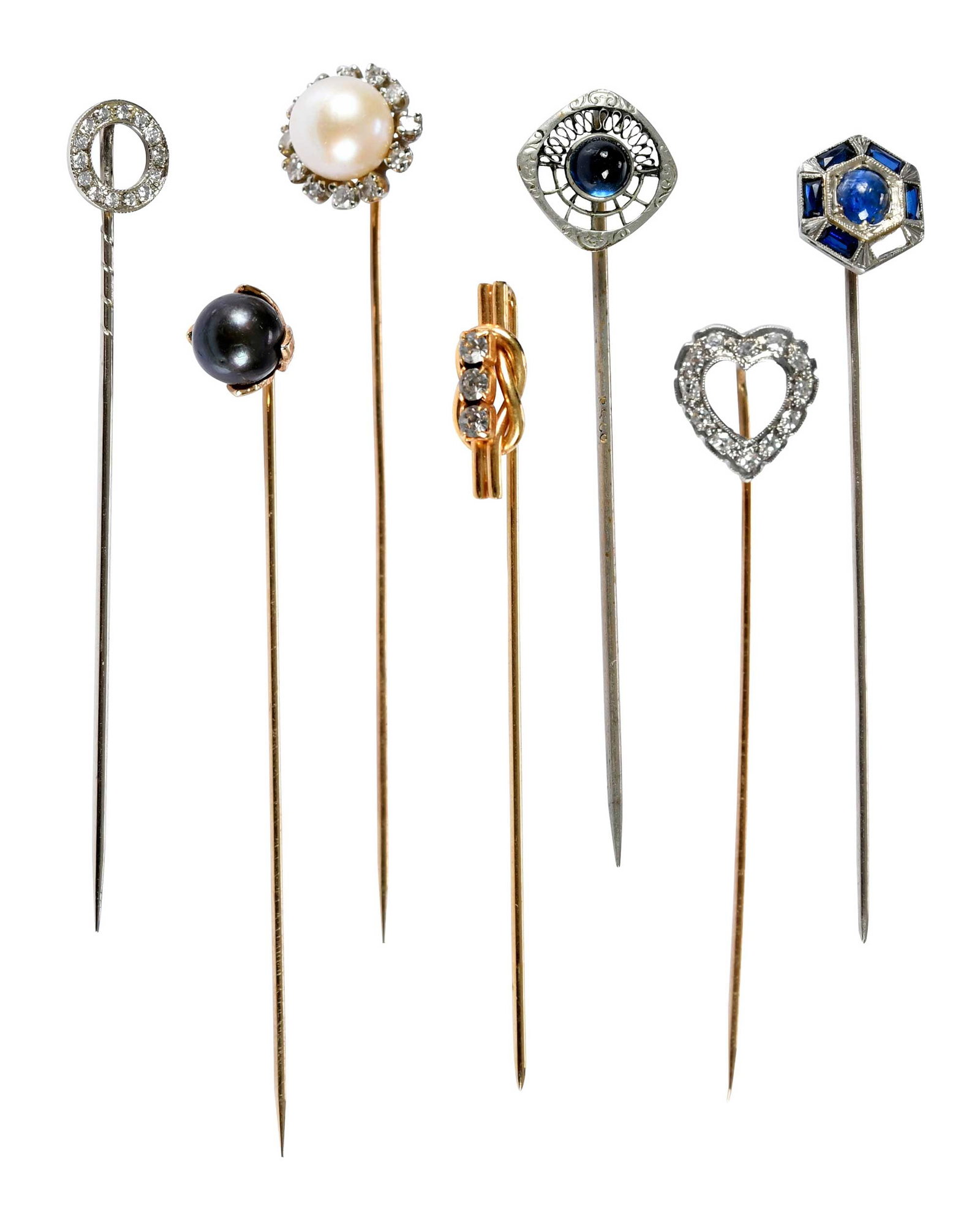 Collection of Seven Assorted Stickpins: comprising: round faceted diamonds, marked "750" 18kt. white gold; white pearl with a round single cut diamond halo, tests 14kt. white gold, stick pin tests not gold; round cabochon blue sapphire, tes