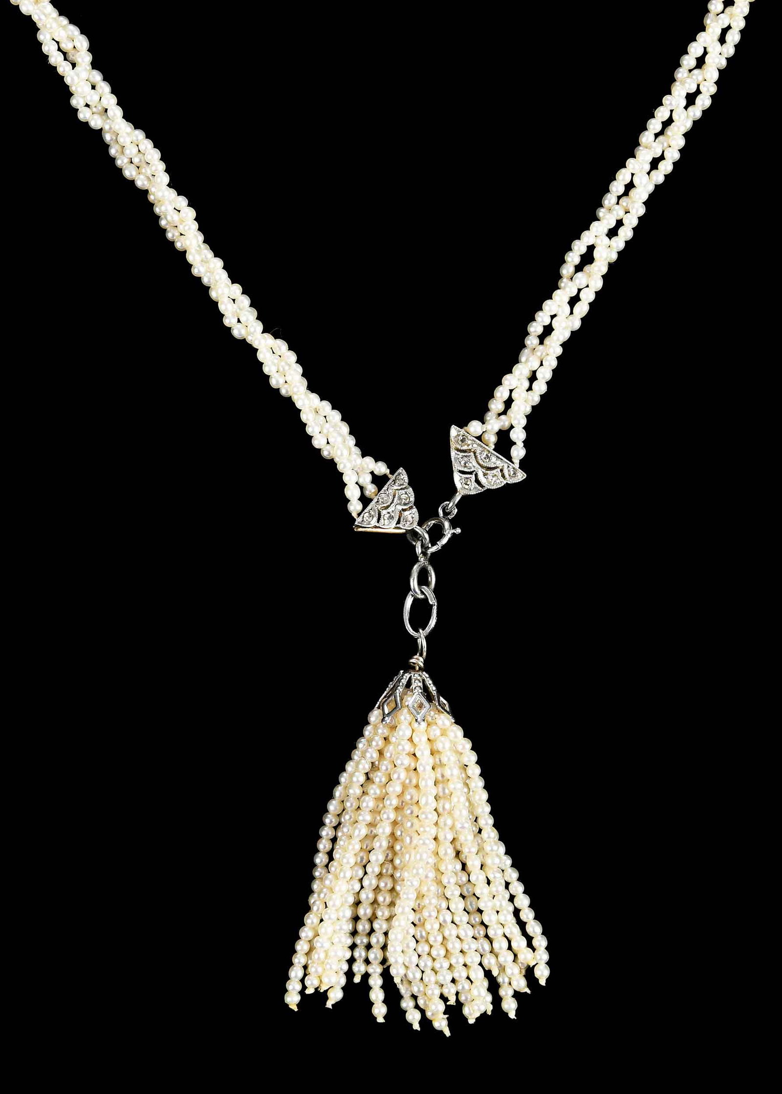 Vintage Diamond Braided Seed Pearl with Tassel Necklace: old cut diamonds, three strands of braided seed pearls, removable seed pearl tassel drop, tests silver backed 14kt. yellow gold, 28 in. length, 2 in. tassel length, 14.1 g Provenance: Private Virginia