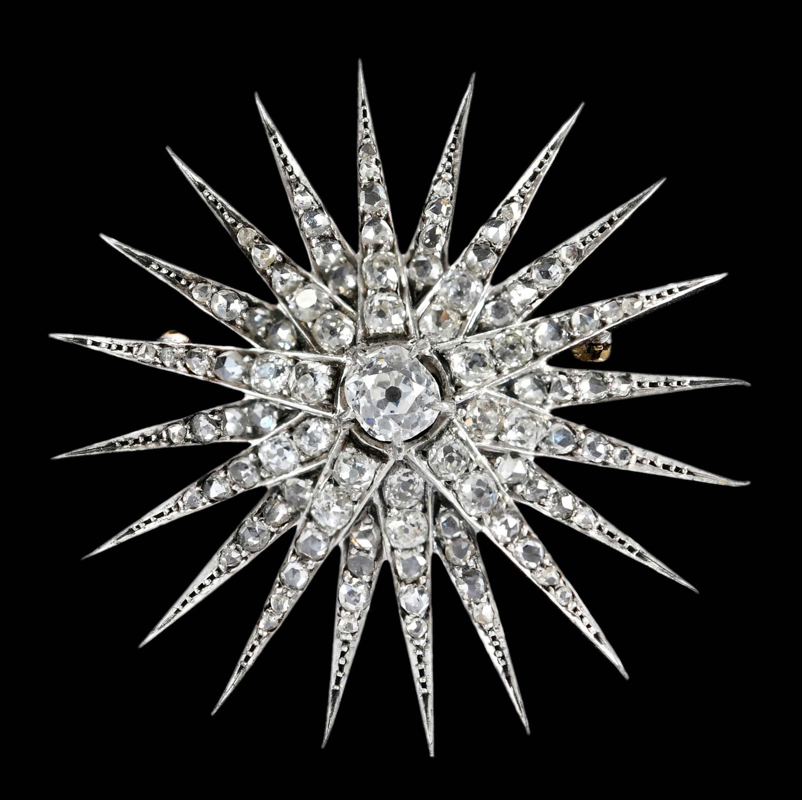 Antique Multi Pointed Starburst Diamond Brooch, in Original Custom Case: center old mine cut diamond, approx. 5.0mm, decorated with delicate old cut diamonds, tests silver with yellow gold backing, 1-5/8 in. diameter, custom case "John Churcher Watchmaker & Jeweller 6 Vict