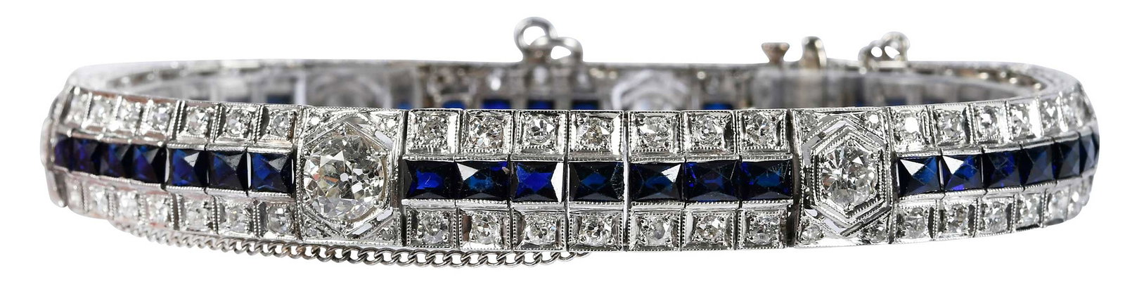 Platinum Art Deco Blue Sapphire and Diamond Line Bracelet: six old European cut diamonds, full and single cut round diamonds, approx. 5.35ctw., 41 calibre cut blue sapphires, approx. 9.75ctw., tests platinum, 8-1/4 in. length, 10.0mm wide, safety chain and la