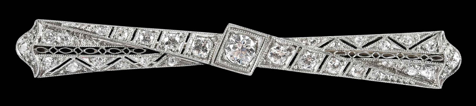 Platinum Open Work Art Deco Diamond Bar Brooch: center round transitional cut diamond, approx. 4.0mm, round full cut and single cut diamond accents, tests platinum, 2-1/2 in. length, 8.3 g Provenance: Private Virginia Collection Note: Brunk Auction