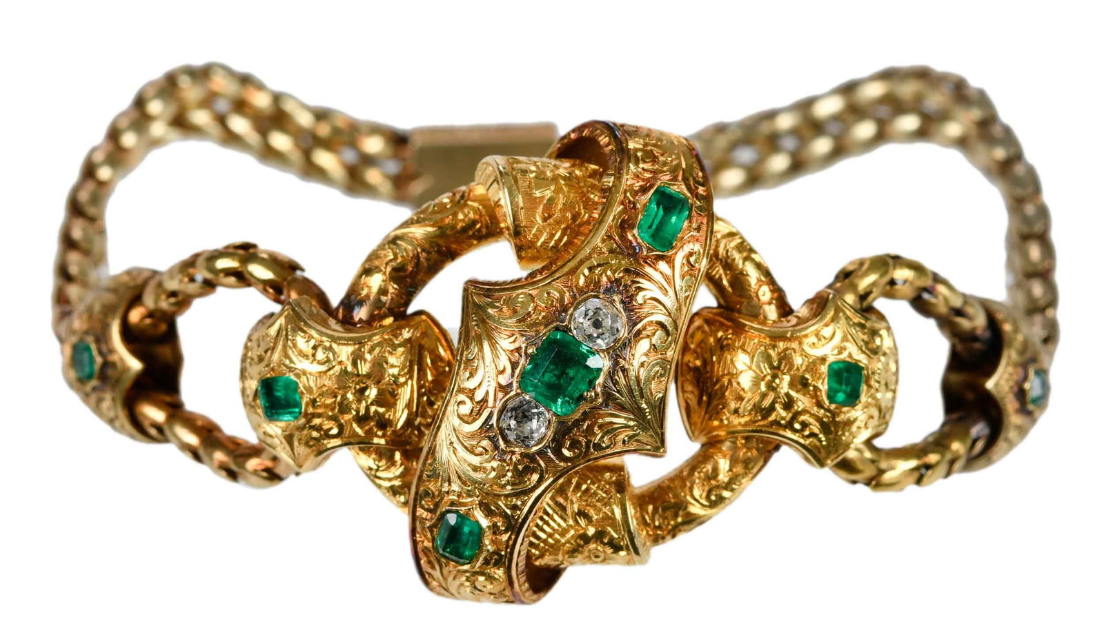 Victorian Diamond and Emerald Knot Bracelet: mixed old cut emeralds, old cut diamonds, detailed engraved design, tests possibly 18kt. yellow gold, double fancy link chain, 6-3/4 in. length, 25.0mm wide, 18.0 g, custom fitted satin lined case Pro