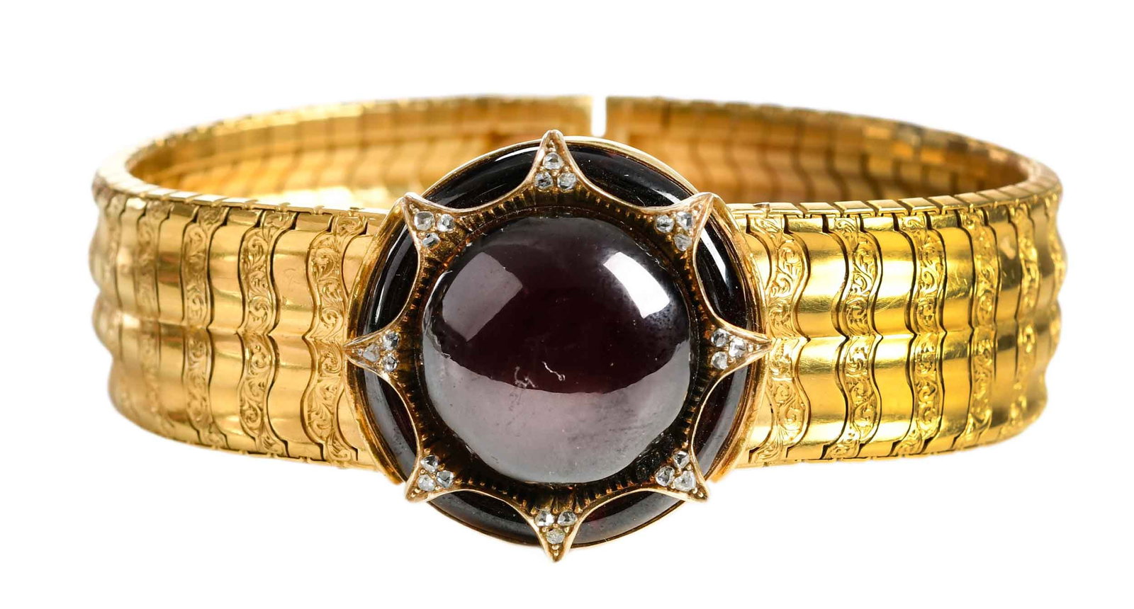 Gold Victorian Carbuncle and Diamond Starburst Bracelet in Fitted Case: round carbuncle, calibre cut garnet frame, old cut diamonds, articulated detailed engraved links, tests possibly 15kt. yellow gold, open locket window compartment, 7 in. length, 18.0mm wide, 47.9 g, c