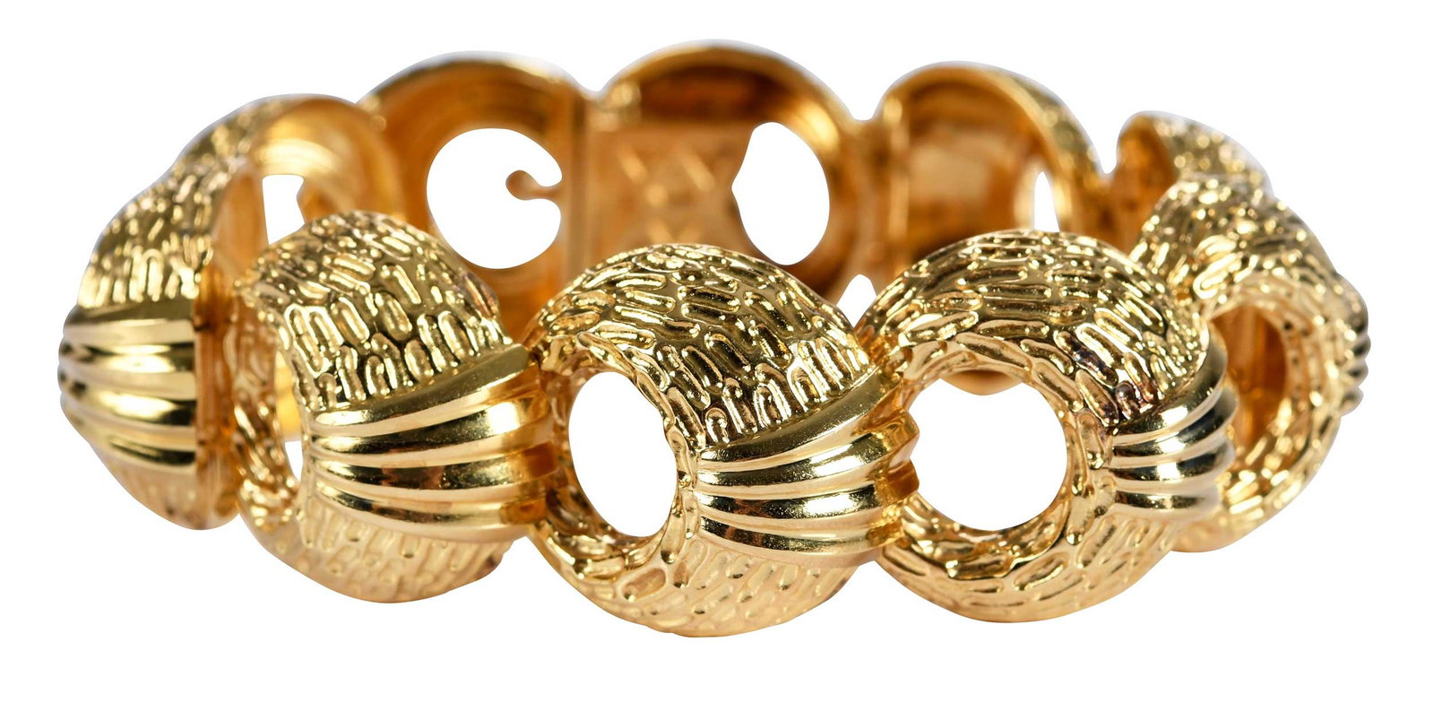 18kt. Crescent Shaped Textured Link Bracelet: high polish and deep ridged texture finish, articulated links, marked "18K, PM", yellow gold, 7 in. inside measurement, 22.0mm wide, 109.5 g Provenance: Private Virginia Collection Note: Brunk Auction