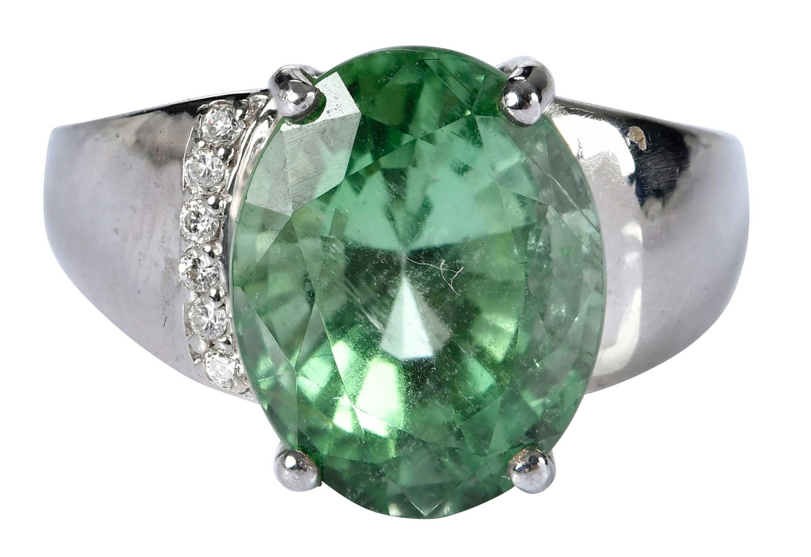 18kt. Light Green Tourmaline and Diamond Ring: modified oval faceted tourmaline, approx. 8.25ct., round faceted diamonds, marked "18K", white gold, 9-1/4 ring sz., 9.1 g Provenance: Private Collection, Virginia Beach Note: Brunk Auctions makes no 