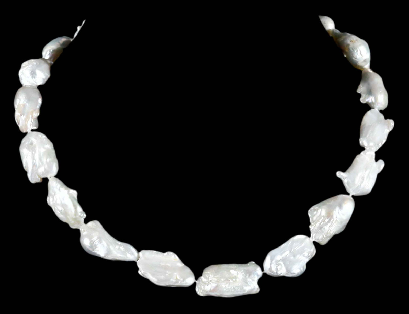 14kt. Baroque Keshi Freshwater Pearl Single Strand: asymmetric baroque pearls, silver white body color, metallic orient, approx. 24.0 x 14.5mm, marked "14K", yellow gold, 19 in. length, 85.9 g Provenance: Charlottesville, Virginia Collection Note: Brun