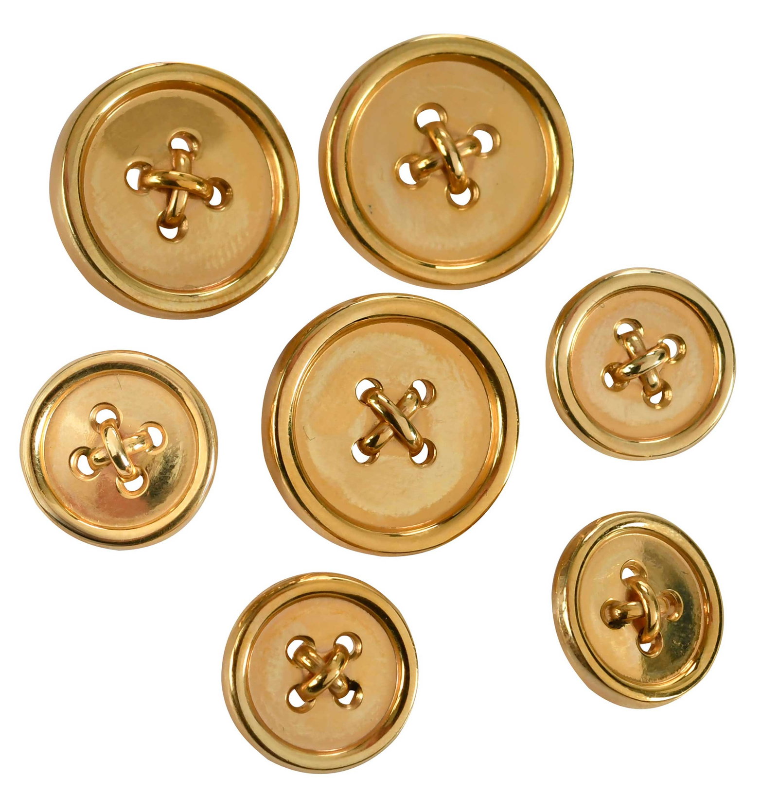 14kt. Tiffany & Co. Blazer Button Set: seven high polish finish, marked "14K, TIFFANY & Co", yellow gold, three 19.0mm, four 14.0mm, 34.1 g, accompanied with Tiffany & Co. box Provenance: Private Virginia Collection Note: Brunk Auctions do