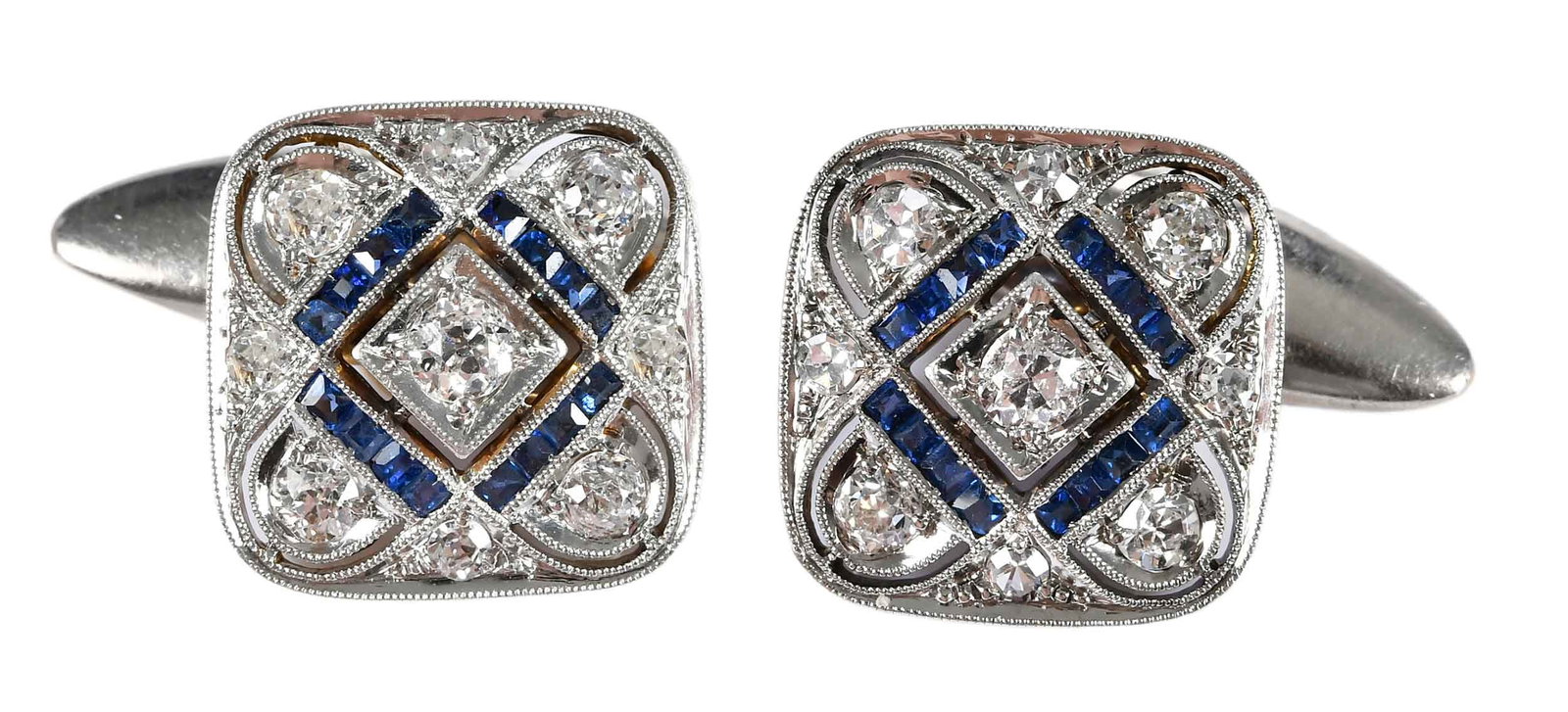 18kt. Art Deco Open Work Blue Sapphire and Diamond Cufflinks: old European and single cut diamonds, approx. 0.90ctw., 32 calibre cut blue sapphires, marked "18K" yellow and white gold, 13.0 x 13.0mm, 6.7 g Provenance: Collection of William W. Sauer, Virginia Bea