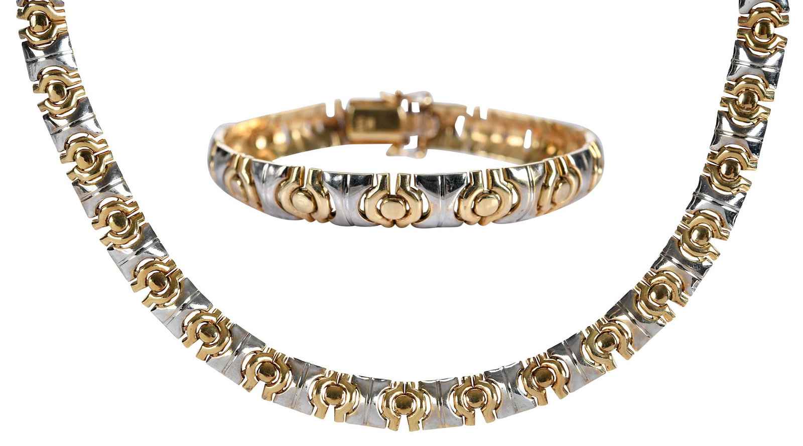 14kt. Two Tone Stampoto Link Necklace and Bracelet Set: high polish, marked "14K, Italy", yellow and white gold, necklace 16-1/2 in. length, bracelet 7 in. length, 9.0mm wide, 74.7 g Provenance: Private Virginia Collection Note: Brunk Auctions does not gua