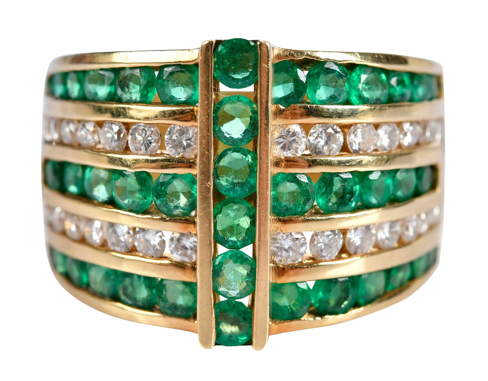 18kt. Alternating Channel Set Emerald and Diamond Cigar Band: four rows of round full cut emeralds, two rows of round full cut diamonds, marked "750", yellow gold, 6-1/4 ring sz, 15.0mm widest, 9.1 g Provenance: Private Virginia Collection Note: Brunk Auctions m