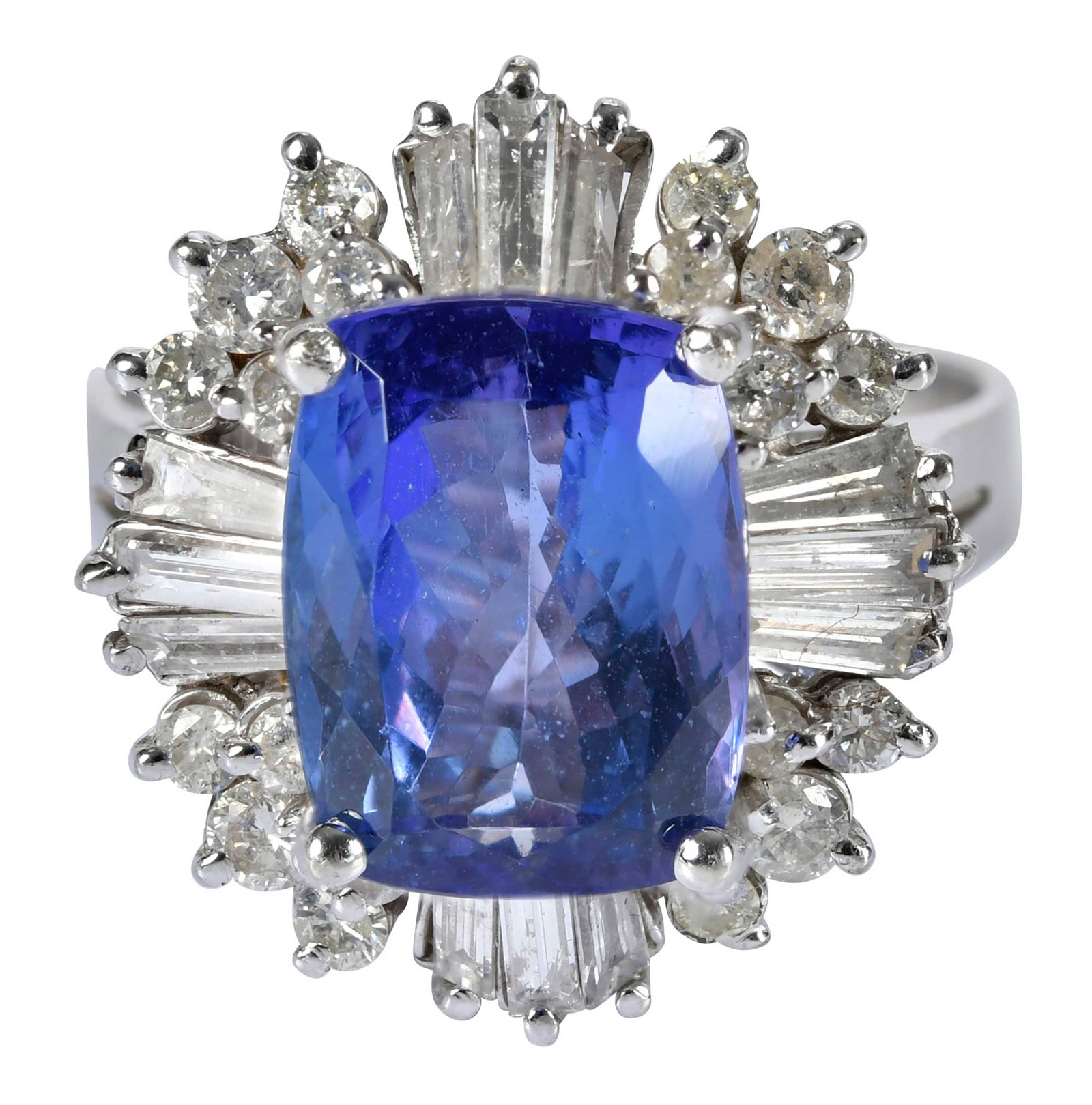 14kt. Tanzanite and Diamond Halo Ring: radiant mix cut tanzanite, approx. 11.0 x 9.0mm, round faceted diamonds, tapered baguette diamonds, marked "K14", white gold, 8-3/4 ring sz., 8.1 g Provenance: Private Collection, Virginia Beach Note:
