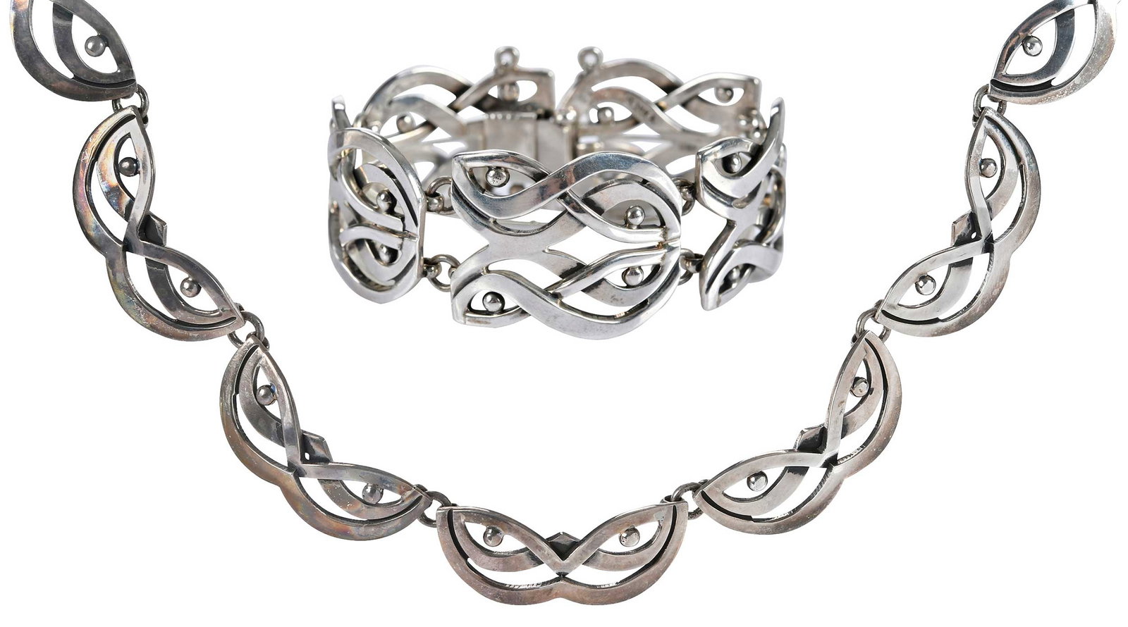 Two Vintage Jose Luis Flores Taxco Silver, Bracelet and Necklace: high polish, pierced links, marked "925 Mexico, Texco", signed JLF, bracelet 6-1/2 in. length, 28.0mm wide, necklace 17 in. length, 14.0mm wide; total weight 141.9 g Provenance: Private Virginia Colle