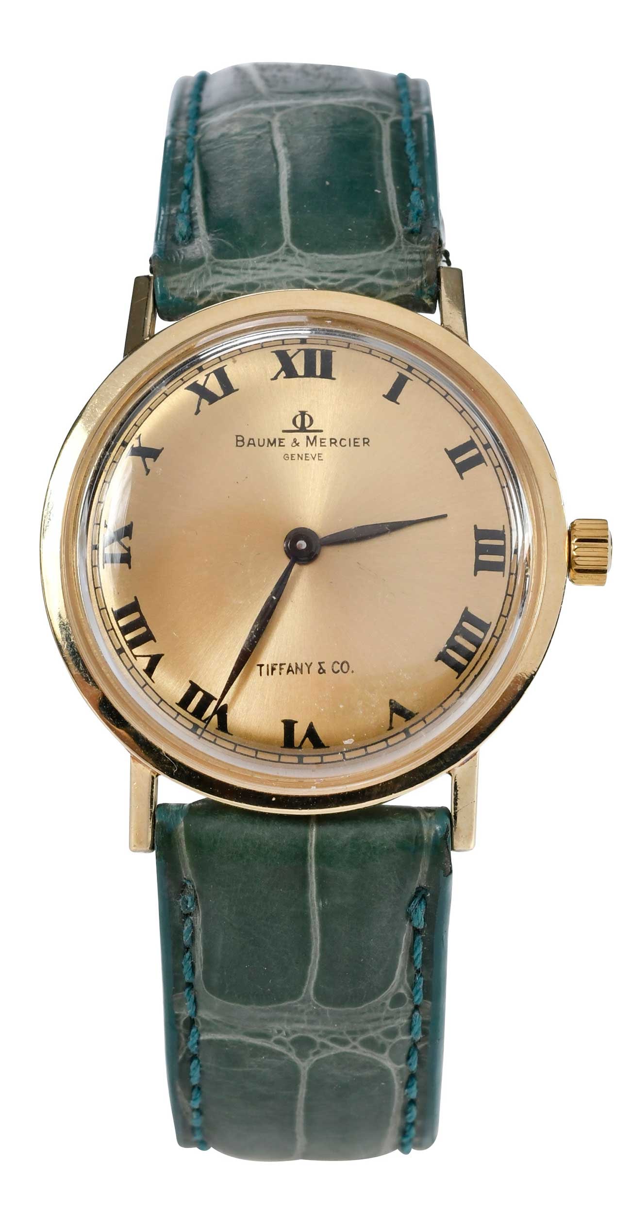 14kt. Vintage Baume & Mercier, Tiffany & Co. Watch with Green Band: 31.5mm, round dial, Roman hour markers, marked "14K, B&M, Tiffany & Co", yellow gold, caliber BM777, green alligator leather band, 8 in. length, total weight 25.3 g Provenance: Charlottesville, Virgin