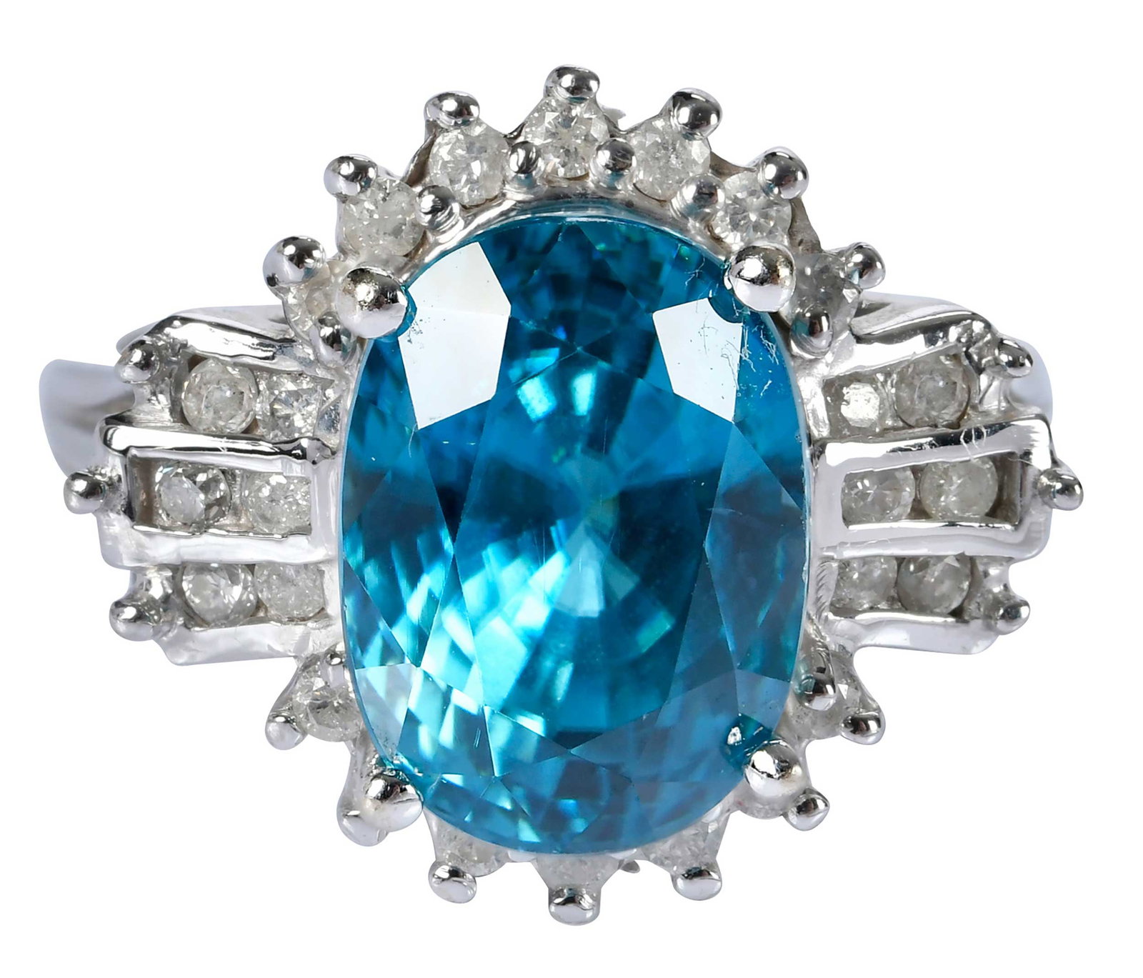 14kt. Blue Topaz and Diamond Ring: oval mixed cut blue topaz, 12.0 x 9.0mm, round faceted diamonds, marked "14k", white gold, 8 ring sz., 8.0 g Provenance: Private Collection, Virginia Beach Note: Brunk Auctions makes no warranty or gu