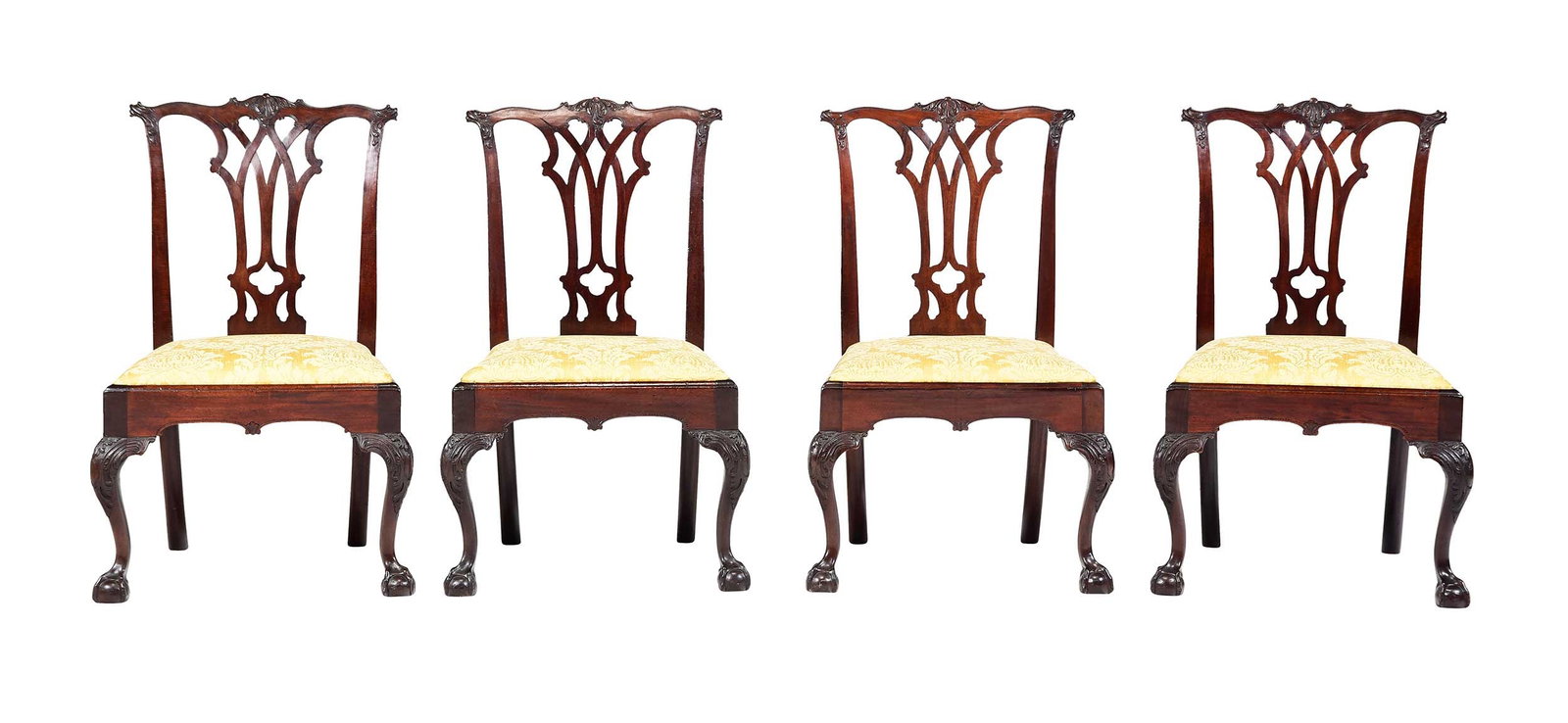 Very Fine and Rare Set Four American Chippendale Carved Mahogany Side Chairs: possibly by the workshop of Thomas Tufft, carving possibly by John Pollard, Philadelphia, Pennsylvania, circa 1775, retaining early dark surfaces, foliate carved crest rail and ears, gothic pierced sp