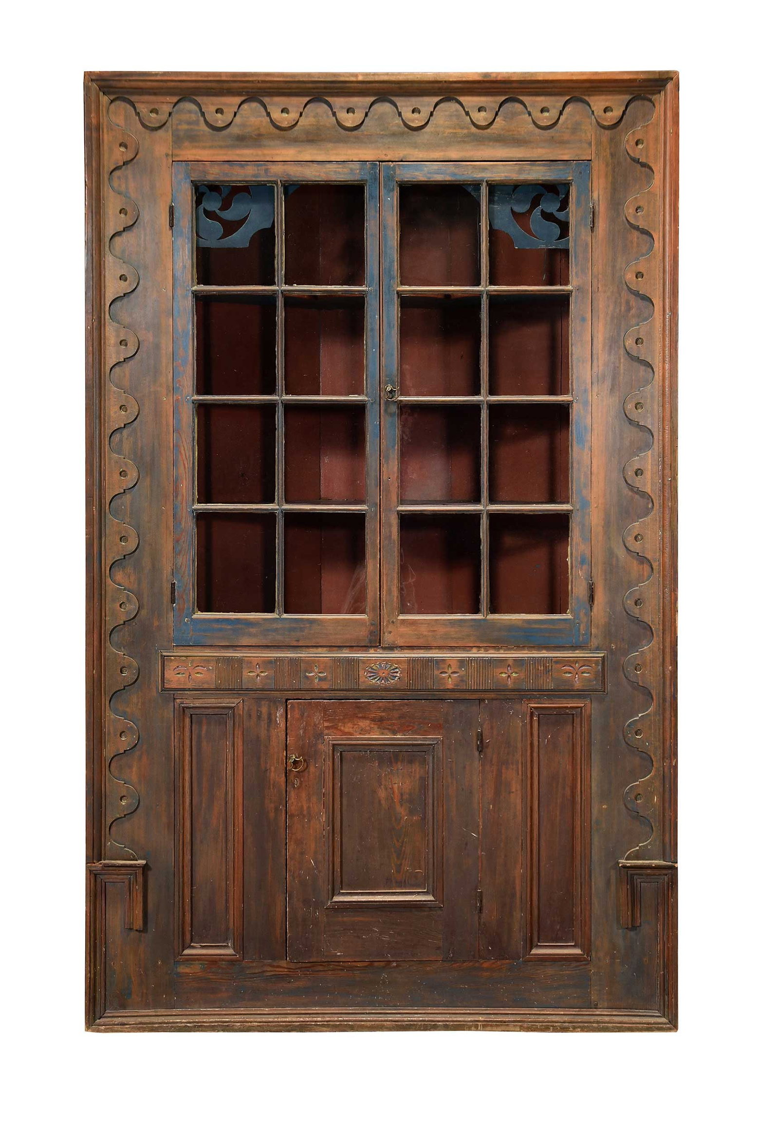 Rare Ralph Family Attributed Delaware Federal Polychrome Painted Corner Cupboard: Sussex County, early 19th century, pine and cherry(?), painted in red, green, and blue, interior with pierced pinwheel brackets, three shaped and fixed shelves, case accented with scalloped trim and