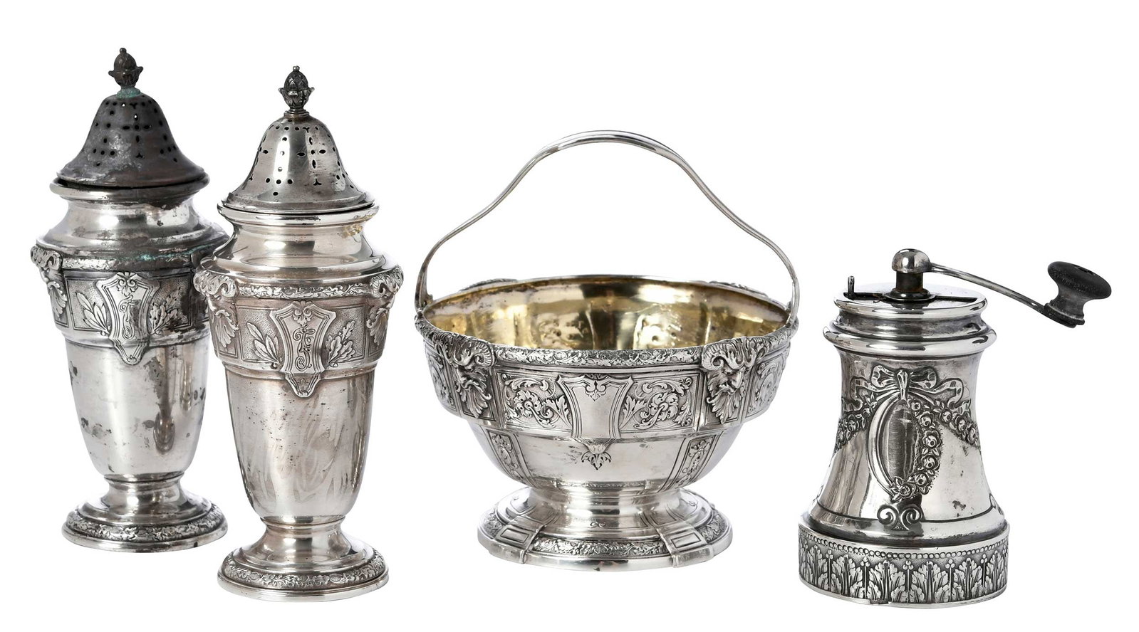 Four Gorham Florenz Sterling Table Items: American, 20th century, all in the Florenz pattern, including sugar basket, pepper mill, pair salt/pepper caster, marks for Gorham, 13.82 oz. T. excluding pepper mill, 6-1/2 in. Provenance: Private Ge
