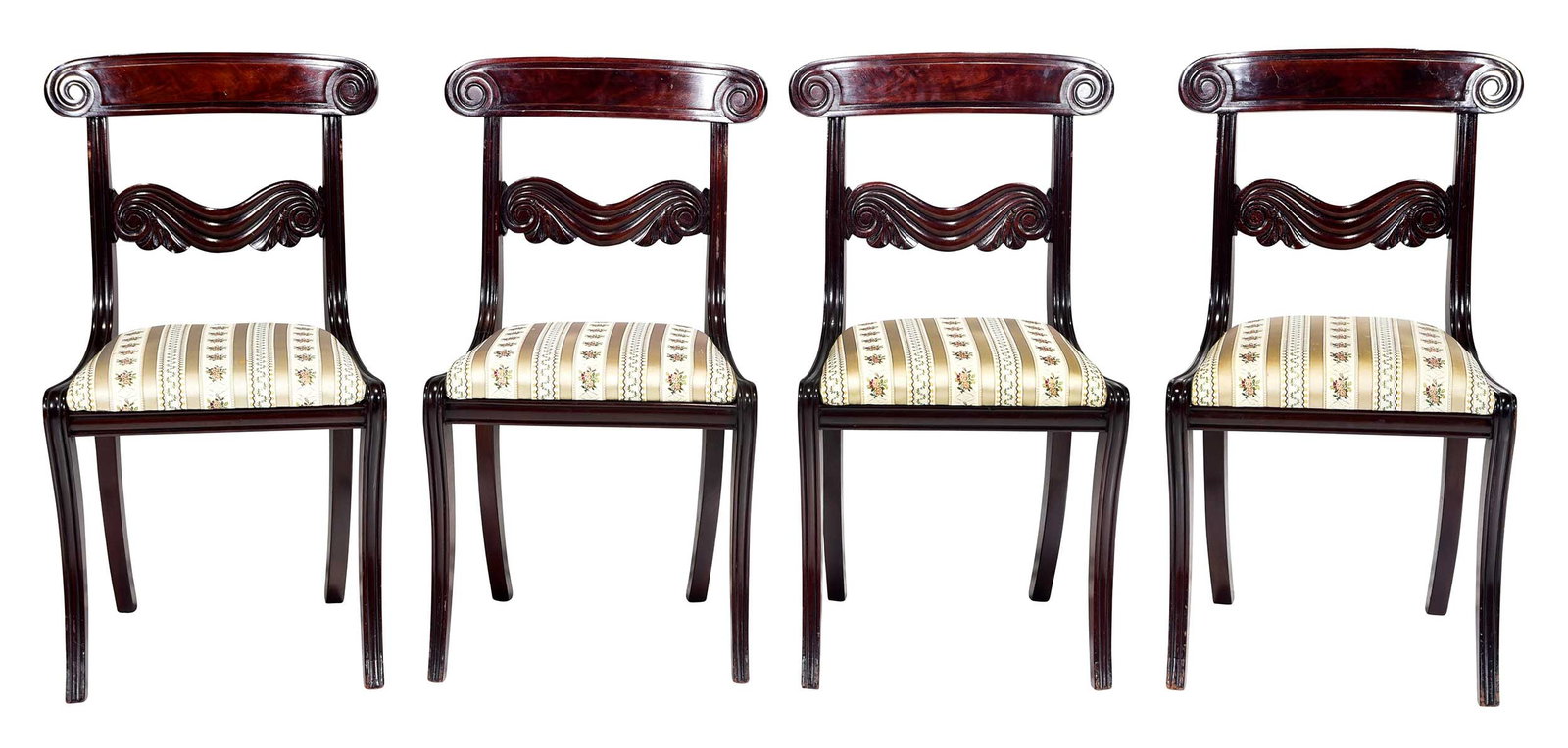 Set Four Boston Classical Figured and Carved Mahogany Klismos Chairs: Massachusetts, circa 1820, figured crest rails with scrolled volutes, scrolled drapery carved stayrails, striped floral motif silk upholstery, 33 x 17-3/4 x 19-1/2 in., seat heights 17-3/4 in.