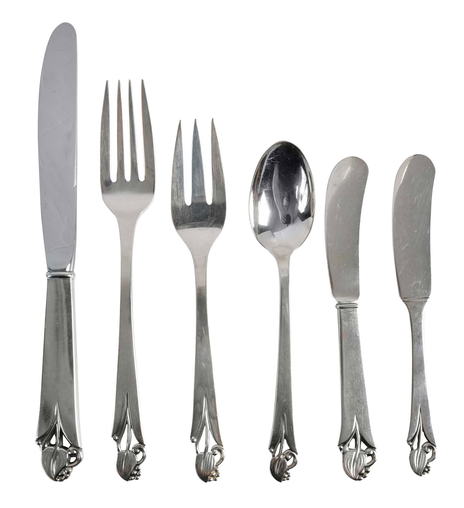 Frank Smith Woodlily Sterling Flatware, 72 Pieces: American, 20th century, including twelve hollow handle knives; fifteen forks; twelve salad forks; twenty one teaspoons; ten hollow handle spreaders with sterling blades; two solid handle spreaders,