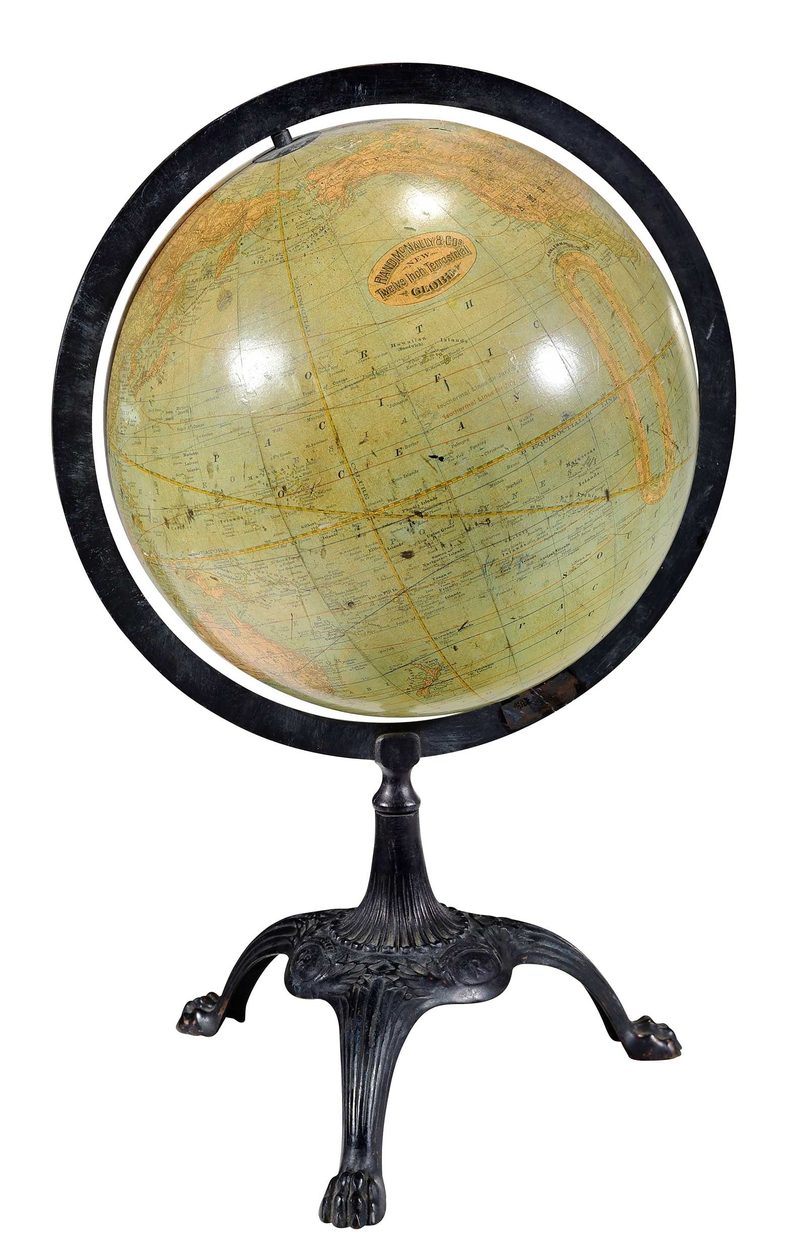 Rand McNally & Co. 12 Inch Terrestrial Globe on Stand: American, early 20th century, on cast iron base with paw feet, approx. 22 x 14-1/2 x 12-1/4 in. Provenance: Private Collection, Richmond, Virginia
