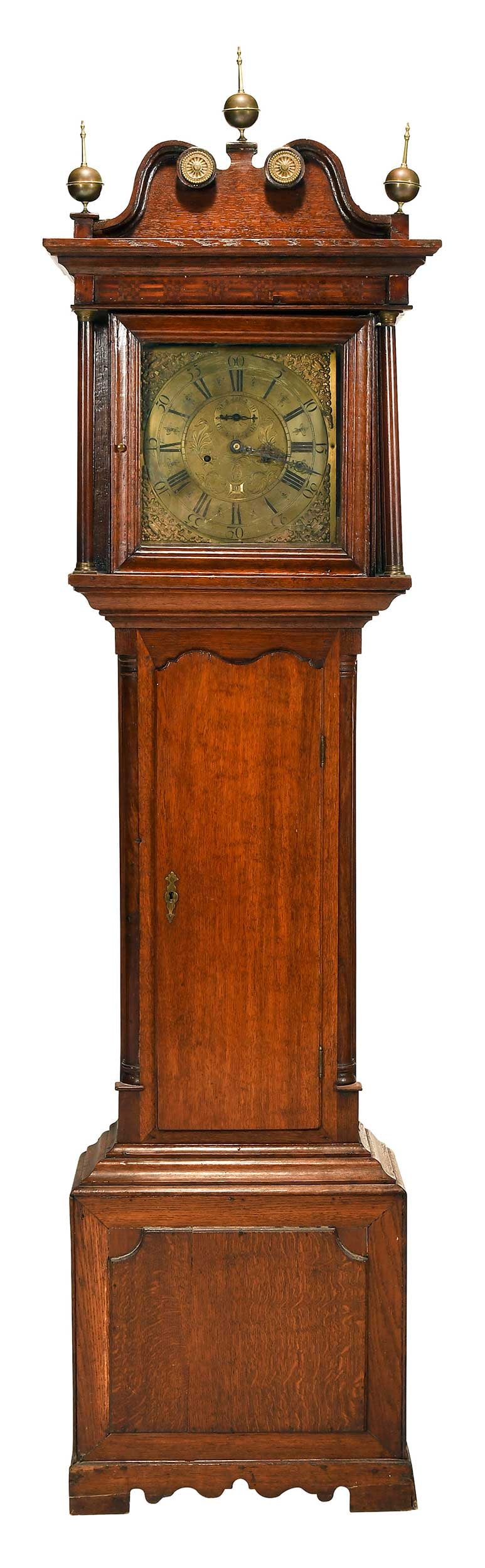 George III Oak Tall Case Clock, Samuel Shepley of Stockport: British, second half 18th century, brass dial with second and day of the month features, inscribed "Sam lt Shepley / Stockport, bonnet with checkered marquetry frieze, brass mounts and finials, oak