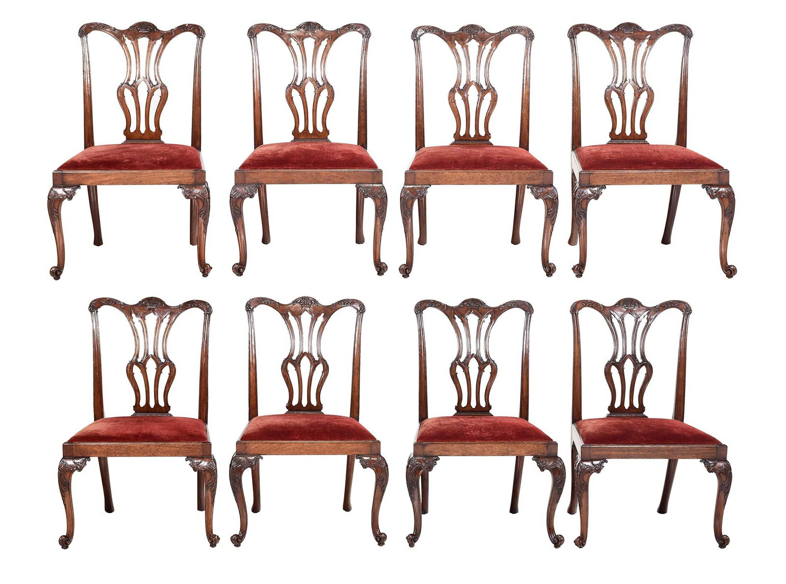 Set Eight George III Style Carved Mahogany Dining Chairs: British, late 19th/early 20th century, serpentine crest rails, pierced splats, wide trapezoidal seats, cabriole legs with carved knees and scrolled feet, red velvet upholstery, 38-1/2 x 25 x 24-1/2