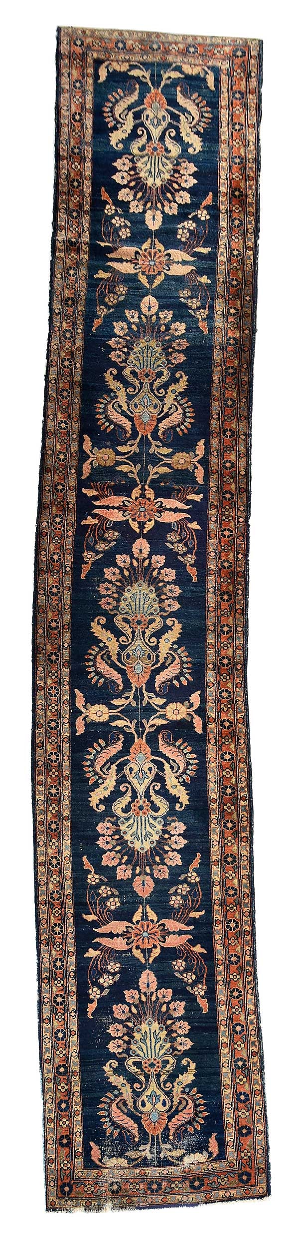 Lilihan Sarouk Runner: early to mid 20th century, navy blue field with central floral medallions, red floral borders, 2 ft. 9 in. x 14 ft. 3 in. Provenance: Private New York Collection