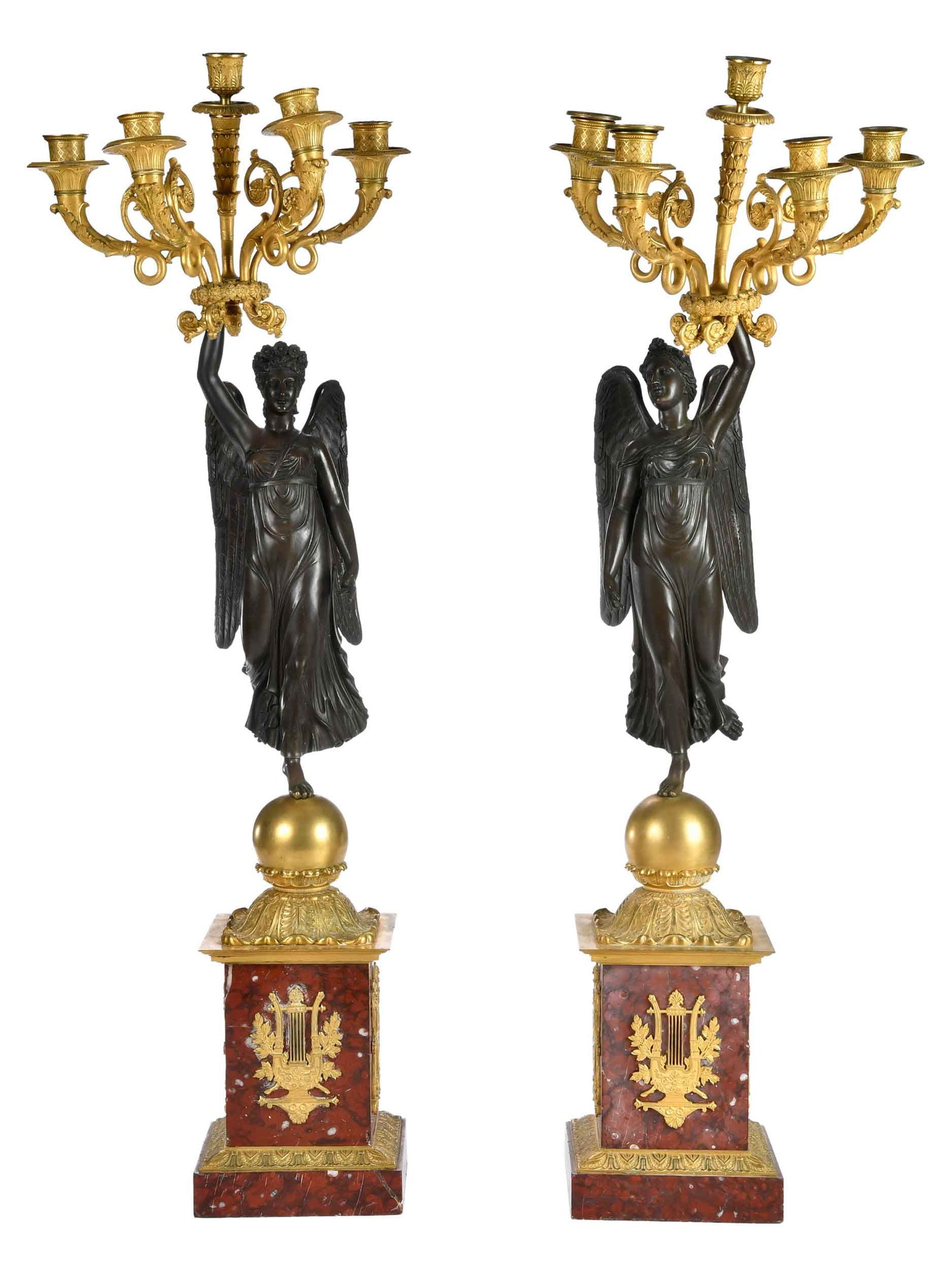 Pair of French Empire Figural Five Light Gilt Bronze and Marble Candelabra: 19th century, depicting winged victory atop gilt bronze mounted red marble bases, apparently unmarked, each approx. 35 x 11-3/8 x 11-1/2 in. 