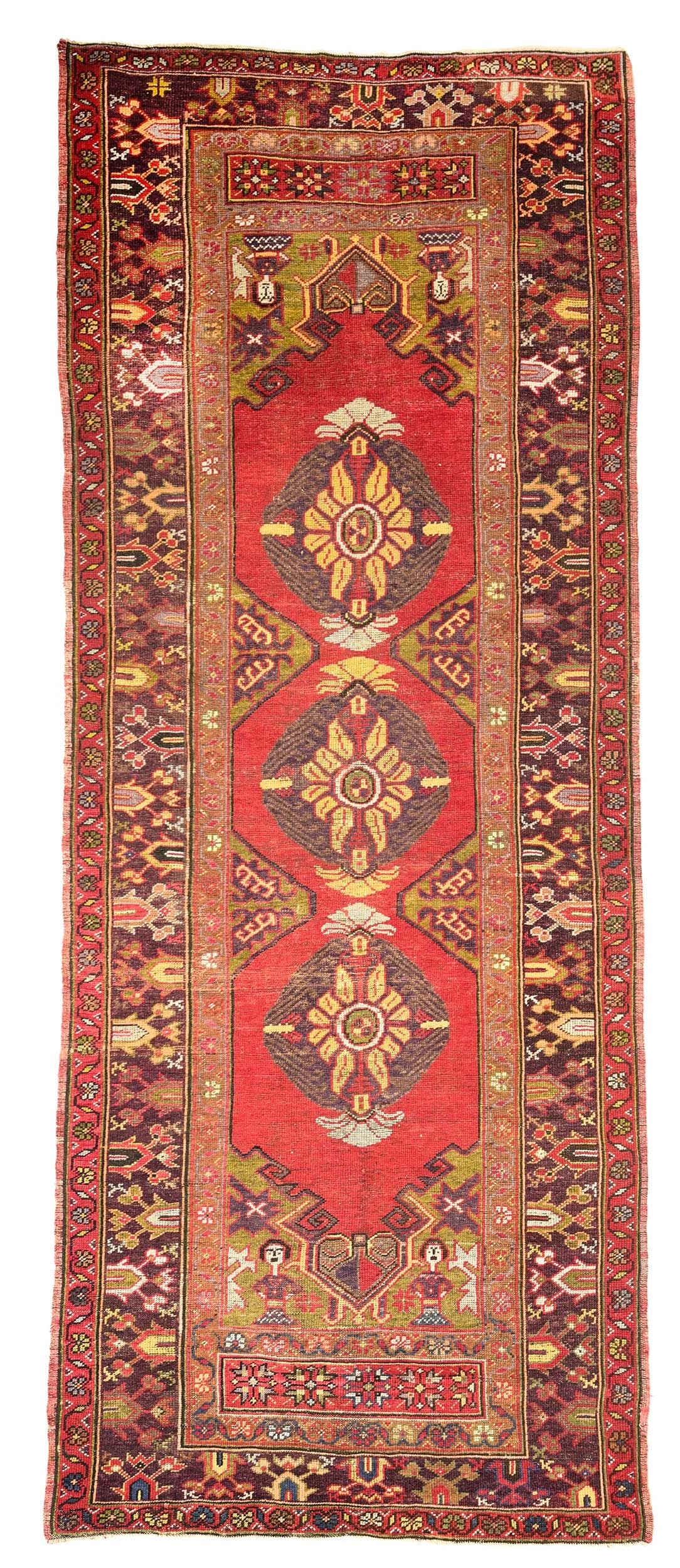 Oushak Runner: early 20th century, red field with three purple colored central medallions, brown border, human figures, 9 ft. 11 in. x 3 ft. 11 in. 