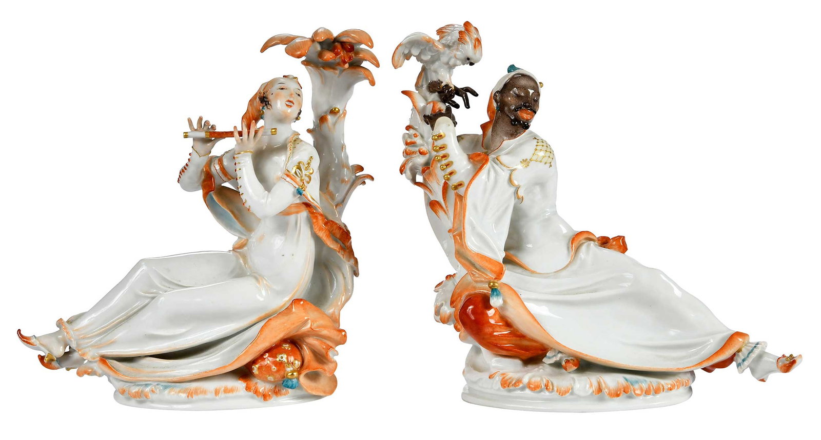 Pair of Meissen Porcelain Reclining Figures with Orange and White Attire: German, late 19th/early 20th century, Orientalin mit Flote and Mohr mit Kakadu, each with crossed swords and "A1146/A1068" marked to bases, larger 8 1-2 x 9 1-2 x 4 3-4 in. Provenance: Collection of S