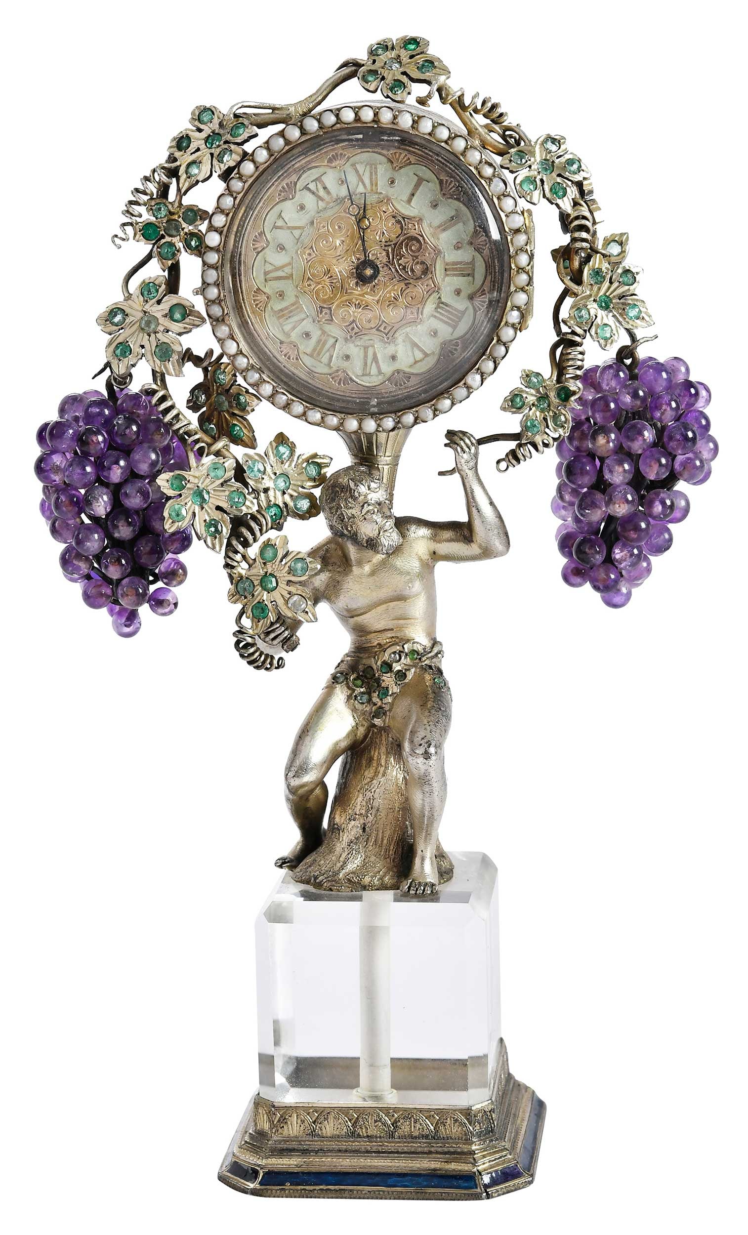Viennese Silver Rock Crystal Clock With Bacchus: Austria, late 19th century, central figure holding click with vine and amethyst grape decoration, accented green stones, on rock crystal silver base, enamel highlights, movement inscribed "Ferdinand R