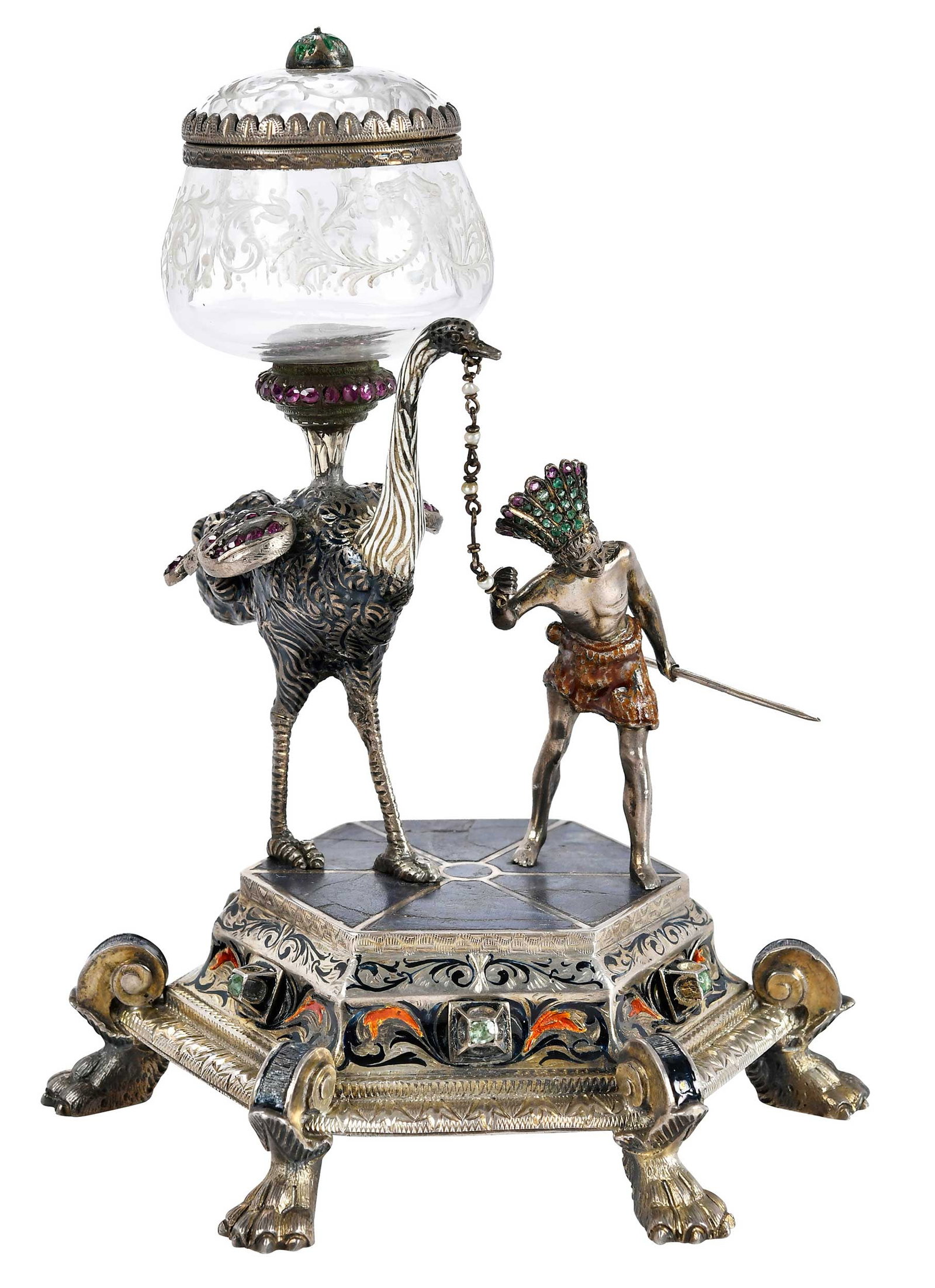 Viennese Enameled Silver Jeweled Figural Lidded bowl: late 19th century, ostrich with rock crystal lidded bowl, native figure with headdress holding spear, hexagon form base with lapis floor, highlighted with pink sapphires, emeralds, and enamel, marked