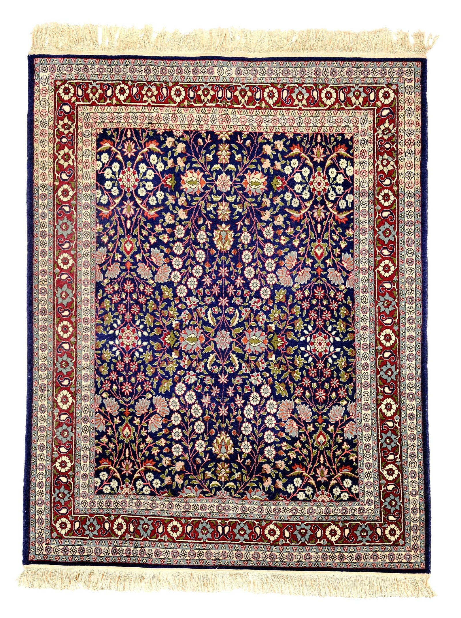Tabriz Rug: 20th century, blue field with leafy flowering vines, red border, 5 ft. 8 in. x 4 ft. 4 in. Provenance: Private Asheville Collection