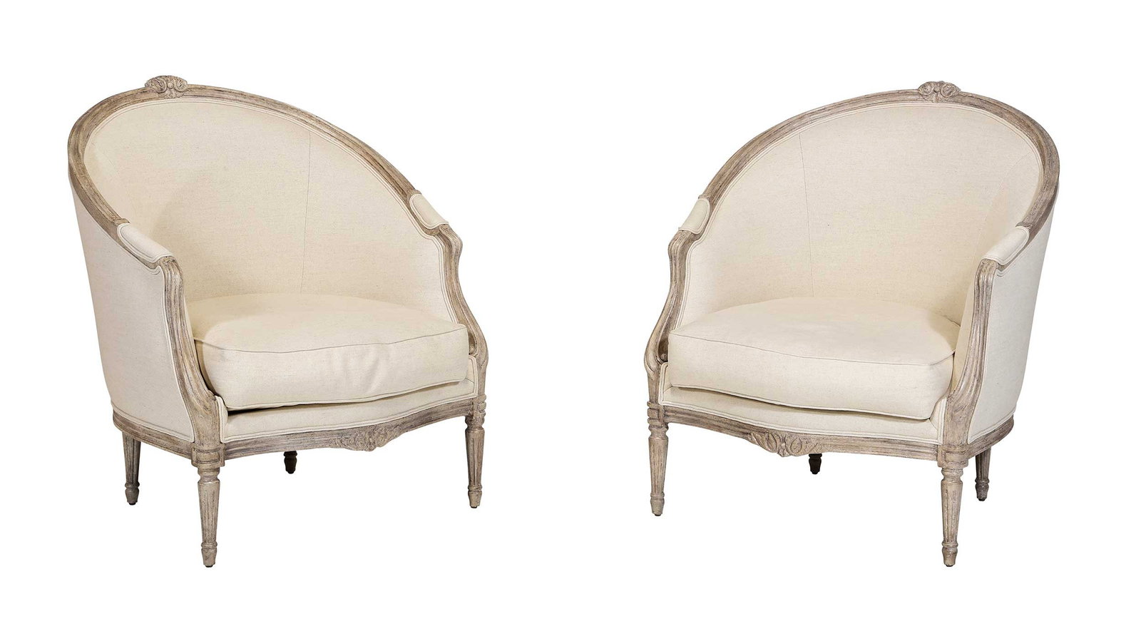 Minton-Spidell Pair of Louis XVI Style Barrel Back Bergeres: 20th century, patinated white painted carved frames, oatmeal linen and cotton blend upholstery, labels to undersides, 38-3/8 x 31-1/2 x 33 in., seat heights 18 in. Provenance: Private Asheville