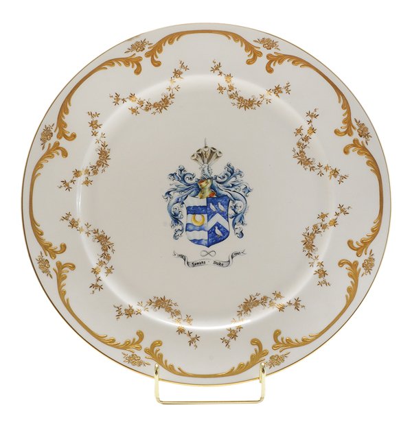 Minton Semans-Duke Family Plate: English, late 20th century, white porcelain plate with Seman-Duke family crest in center, gilt floral and scroll decoration, marks for Minton, excellent condition. Provenance: Les Terrasses