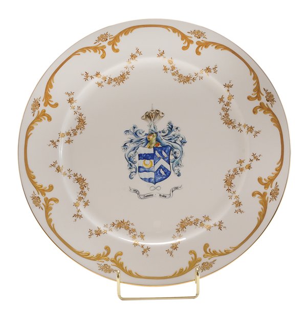 Minton Semans-Duke Family Plate: English, late 20th century, white porcelain plate with Seman-Duke family crest in center, gilt floral and scroll decoration, marks for Minton, excellent condition. Provenance: Les Terrasses