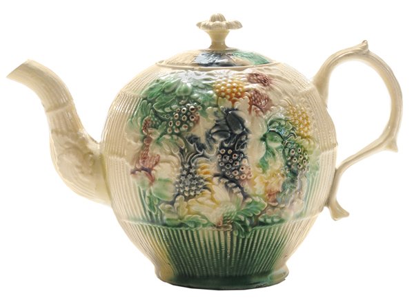 William Greatbatch Creamware: Teapot English, Staffordshire, 1765-1770, birch or basket background, molded fruits and vegetables, molded handle and spout, attributed to Greatbatch (unmarked), 4-3/4 in., chip to interior edge of li