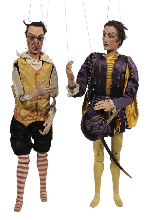 Two Italian Marionettes: (19th/20th century) A Hero and a Protagonist, likely Neapolitan or Sicilian, carved and painted wood, original clothing, 32 in., lacking strings and cross pieces, some losses to digits and hair. Prove