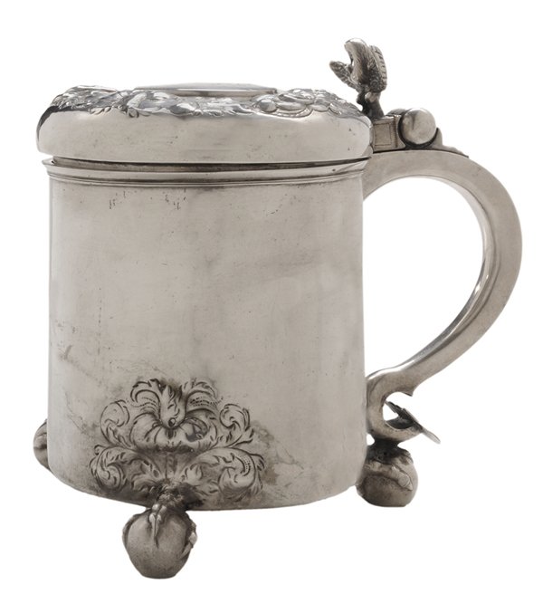 Scandinavian Silver Tankard: 18th century, lid with floral repousse border, spread eagle thumb piece, ball and claw feet with foliate decoration, peg interior, marked with conjoined "PL" in shield, "LKS/MP/1715", 18.04 oz.T., 6-1