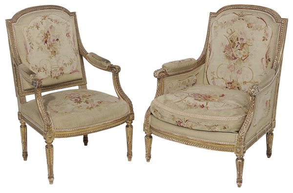 Pair Louis XVI Style Tapestry-: Upholstered Open-Arm Chairs French, 19th century, each with leaf-carved gessoed and gilt frame set with Aubusson upholstery, his-and-hers suite, his 38 x 24 x 22 in., hers 37-1/2 x 27-1/2 x 25 in., up
