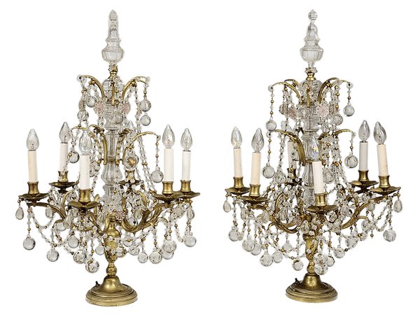 Large Pair Brass and Crystal: Girandoles French, early 20th century, each with faceted crystal finial and stem issuing two tiers of hanging garlands and balls and one tier of scrolled candle arms (six arms each), set with pink gla