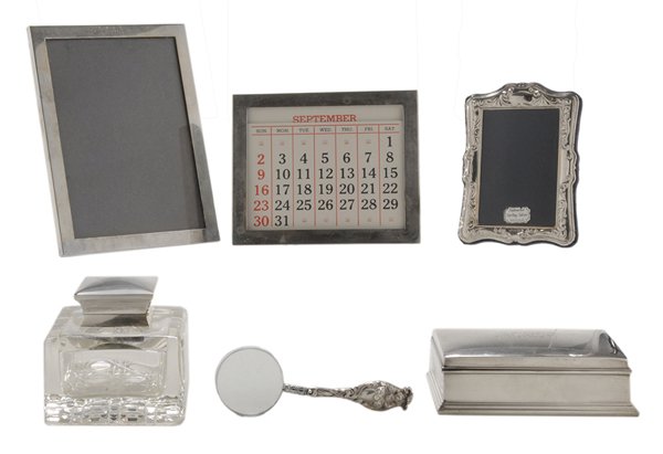Six Pieces Desk Accessories: including three sterling frames: one trophy; one with calendar; one English, 5-1/2 in. to 8-1/4 in.; glass inkwell with English silver lid, 4 x 4-1/4 x 4-1/4 in.; Gorham box, 2-1/4 x 5-3/4 x 3-5/8 in.