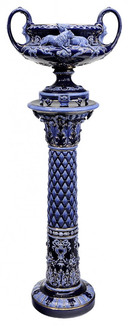 Rorstrand Jardiniere and Pedestal: Sweden, 19th century, majolica dark and light blue jardiniere and pedestal with gilt highlights; four-footed jardiniere with figured wolf attacking a deer on one side at top and figured wolves playing