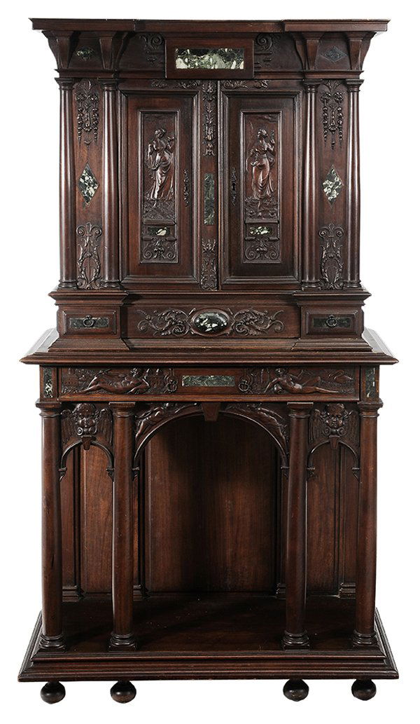 Henry II Style Carved and Marble-Inset: Cabinet Continental, late 19th century, carved walnut in two parts, the carved frieze with green-to-ivory inset marble over two figurally carved doors, shelved interior over three additional dovetaile