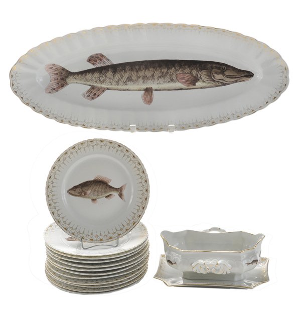 Fourteen-Piece Karlsbad Fish Set: Austria, late 19th century, impressed Victoria Karlsbad Austria, including twelve 8-3/8 in. gilt fish plates, [some with gilt losses]; large oval platter, with fish decorated center, 2 x 24-1/4 x 9-3/