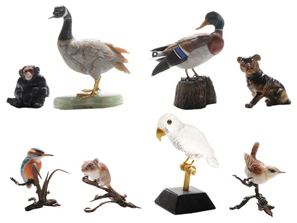 Eight Carved Hardstone Figures,: Three Hand Painted Porcelain Figures Paul Dreher carved lapis lazuli mallard duck with various chalcedony, green, black and white agate, red jasper, and tiger eye, base of petrified wood, with technic