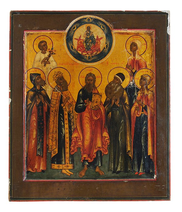 Russian Icon: (18th century) Seven Saints Under the Throne of Christ, signed, tempera and gilding on panel, 12-5/8 x 10-1/2 in., crackle, abrasions, losses, two battens verso, some vertical splitting. Provenance: S