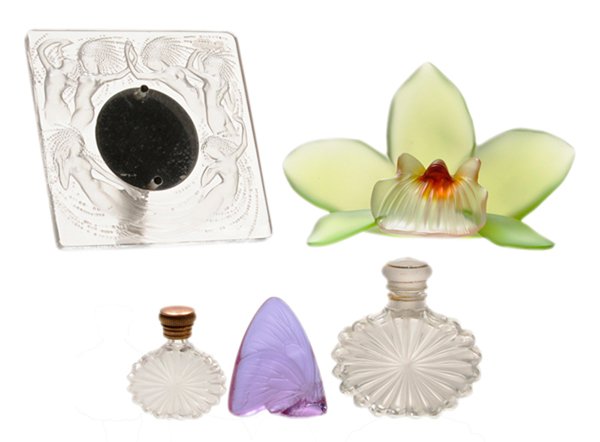 Five Lalique, Crystal Table Articles: French, 20th century: Lalique [Les Naiades] clear table clock frame featuring six mermaids floating around clock with hair covered in bubbles streaming behind, signed lower left, 4-1/4 x 4-1/2 in., [l